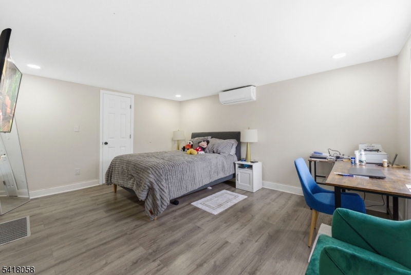 28 Wagners Lane Warren, NJ 07059 - Photo 28 of 50 a bedroom with a bed and a table in it