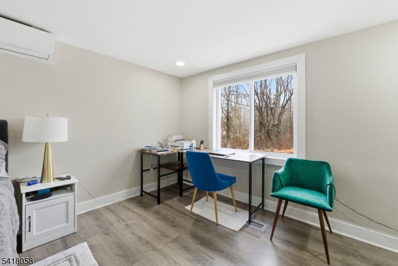 28 Wagners Lane Warren, NJ 07059 - Photo 31 of 50 a workspace with furniture window and a wooden floor