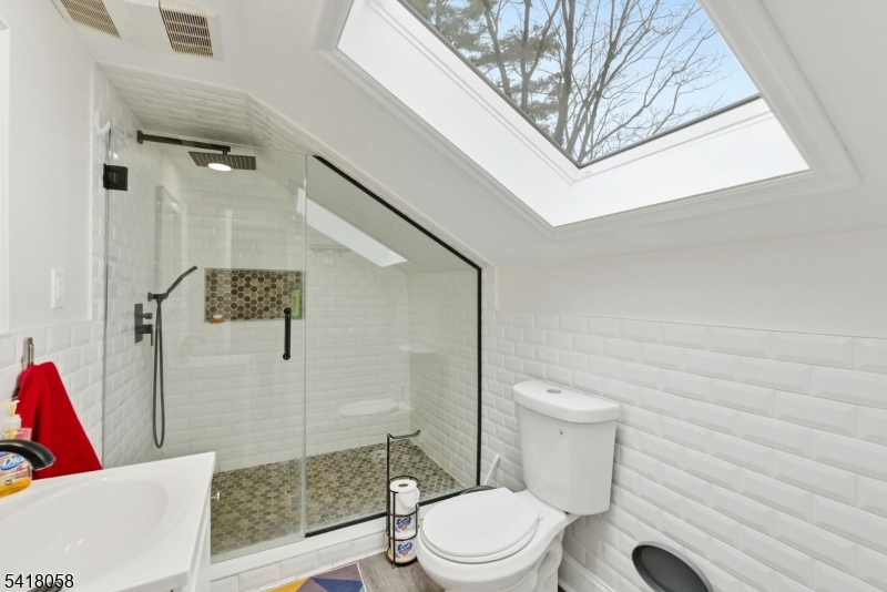 28 Wagners Lane Warren, NJ 07059 - Photo 32 of 50 a bathroom with a toilet and a shower