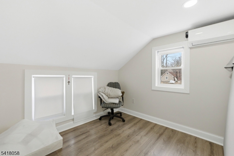 28 Wagners Lane Warren, NJ 07059 - Photo 33 of 50 a view of a workspace room with wooden floor and windows