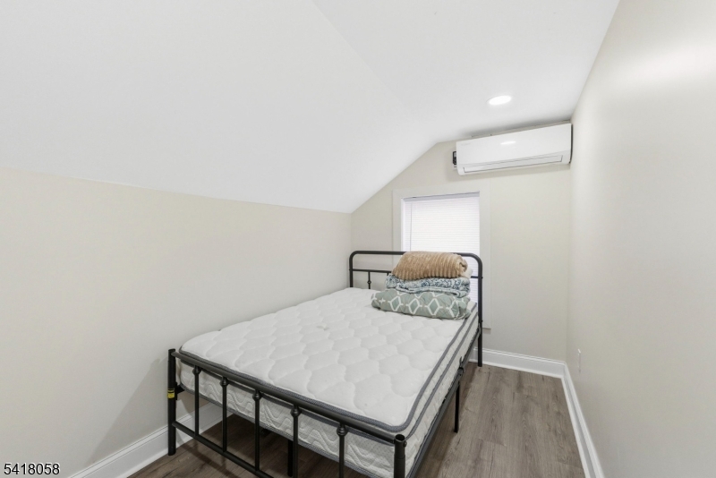 28 Wagners Lane Warren, NJ 07059 - Photo 35 of 50 a bedroom with a bed and a table