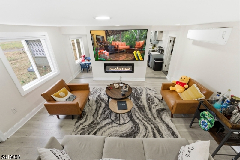 28 Wagners Lane Warren, NJ 07059 - Photo 39 of 50 a living room with furniture and a flat screen tv