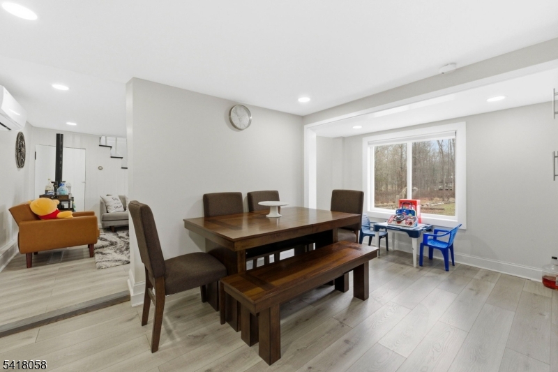 28 Wagners Lane Warren, NJ 07059 - Photo 41 of 50 a living room with furniture and a wooden floor
