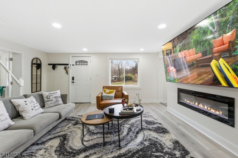 28 Wagners Lane Warren, NJ 07059 - Photo 42 of 50 a living room with furniture and a fireplace