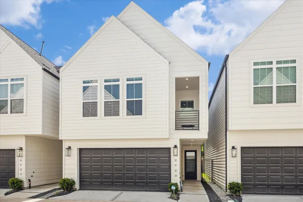a front view of a house with a garage