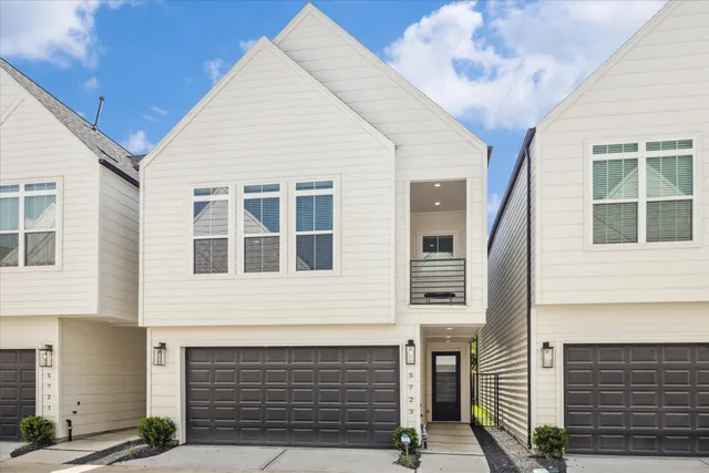 a front view of a house with a garage