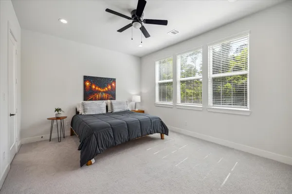 a bed room with a bed and a tv