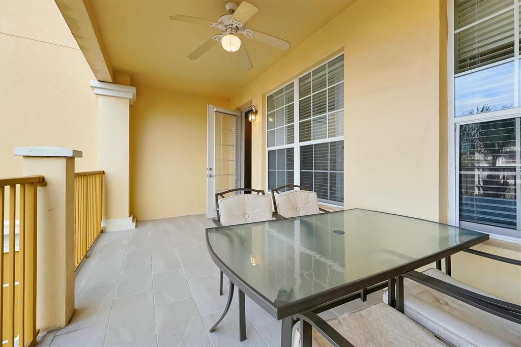 5036 Shoreway Loop, Unit 30105 Orlando, FL 32819 - Photo 19 of 49 a view of a dining room with furniture and wooden floor