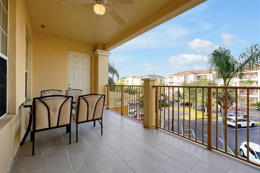 5036 Shoreway Loop, Unit 30105 Orlando, FL 32819 - Photo 20 of 49 a view of a balcony with furniture