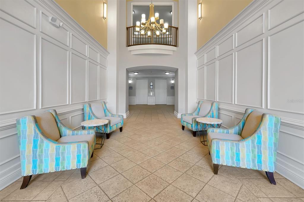 5036 Shoreway Loop, Unit 30105 Orlando, FL 32819 - Photo 30 of 49 a living room with furniture and a fireplace