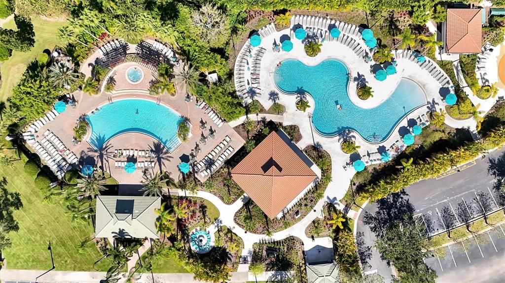5036 Shoreway Loop, Unit 30105 Orlando, FL 32819 - Photo 39 of 49 an aerial view of a house with a yard and swimming pool