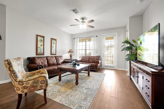 a large kitchen with stainless steel appliances granite countertop a stove a sink and a refrigerator