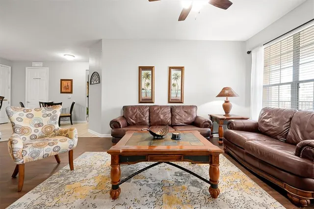 a kitchen with a sink and a view of living room