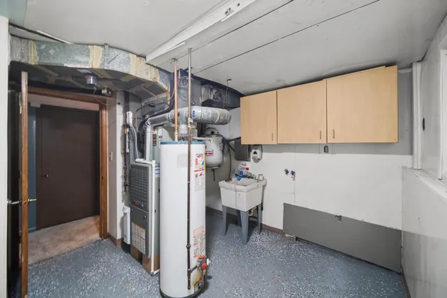 a utility room with multiple dryer and washer