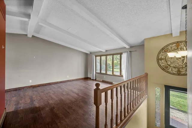 a view of a hallway with windows