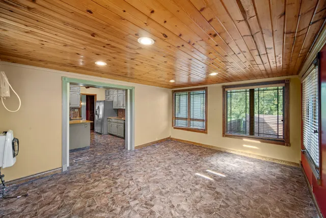 a view of livingroom with an empty space and a window