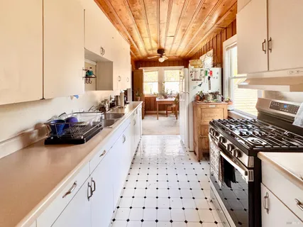 a bathroom with a toilet a sink and shower