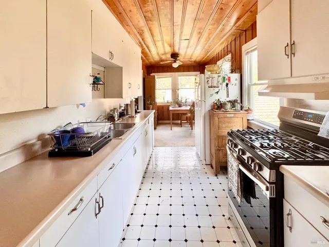 a bathroom with a toilet a sink and shower