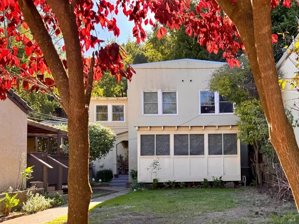 a house view with a garden space