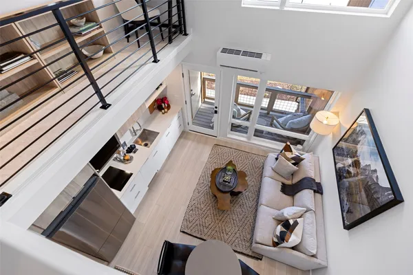 a view of living room with furniture and a rug