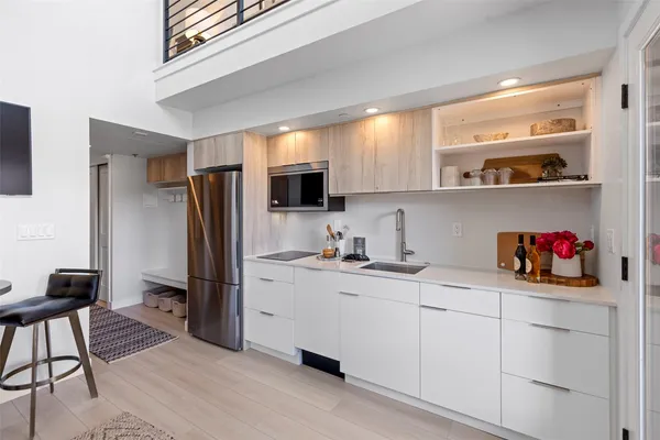 a front view of a building and a mountain view