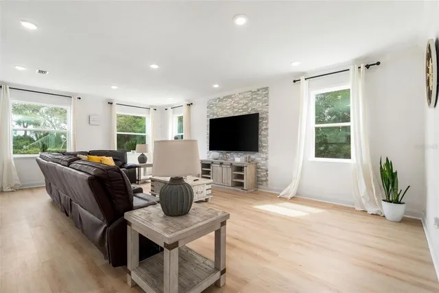 a living room with furniture and a large window