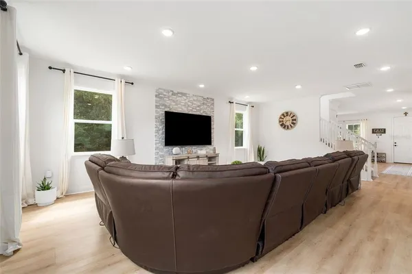 a large kitchen with a table and chairs
