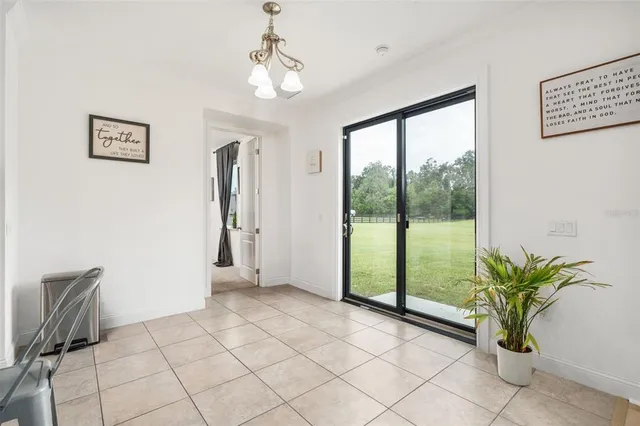 a large kitchen with stainless steel appliances granite countertop a sink and a microwave
