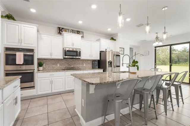 a room with a bed and a ceiling fan