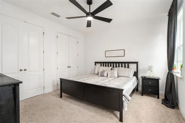 a bedroom with furniture and a window