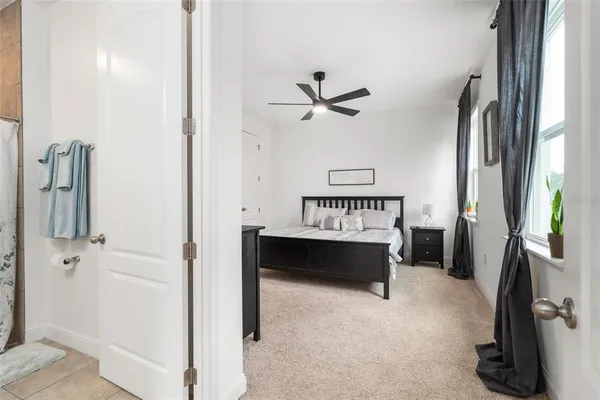 a view of a livingroom with furniture and a large window