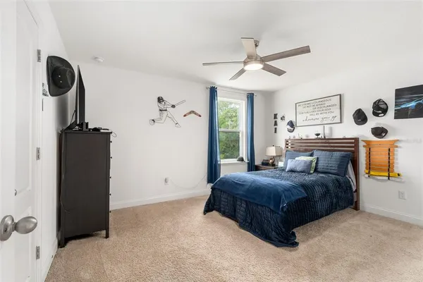 a bathroom with a granite countertop sink toilet a mirror and a shower