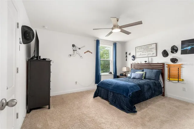 a bathroom with a granite countertop sink toilet a mirror and a shower
