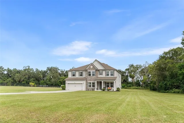 a view of a house with a big yard