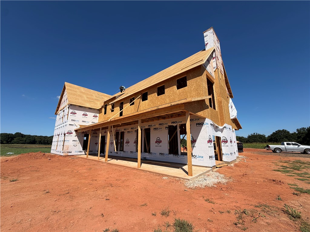 113 Dorchester Road Belton, SC 29627 - Photo 7 of 12 Progress continues on this new construction home showcasing a expansive front porch structure.