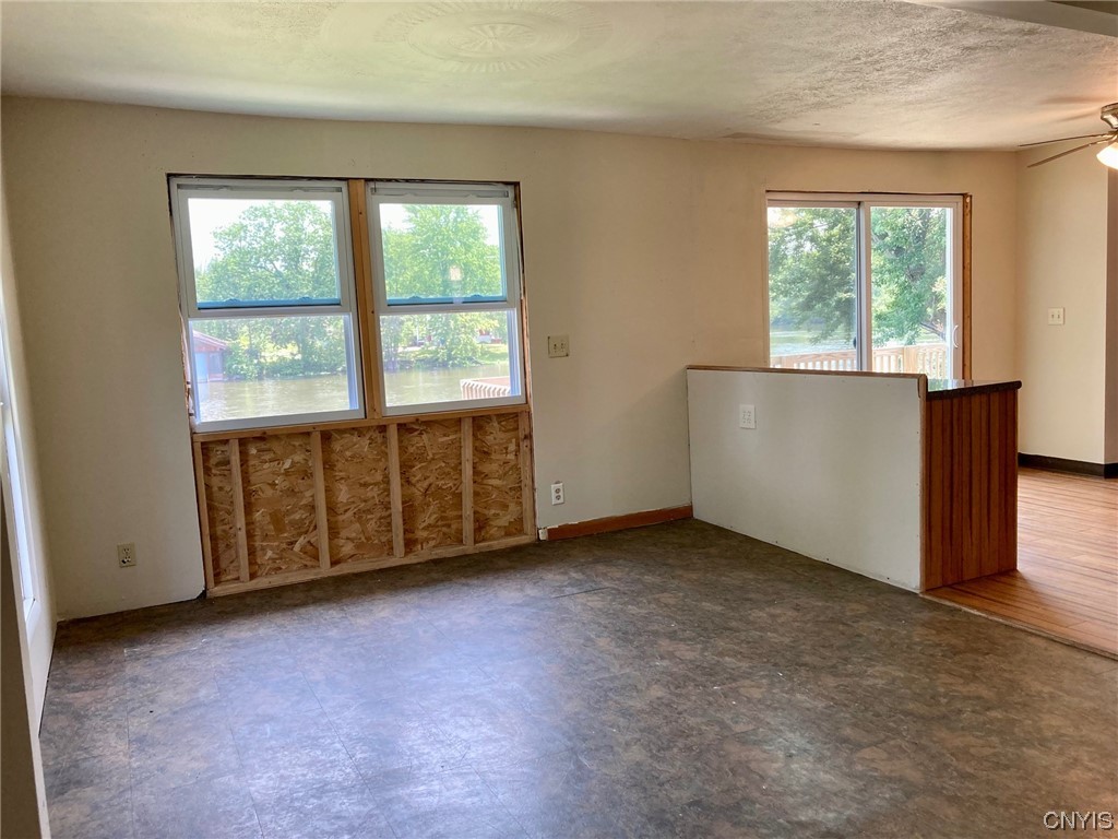 1378 County Rte 12 Schroeppel, NY 13132 - Photo 12 of 35 Living area with views to the river.