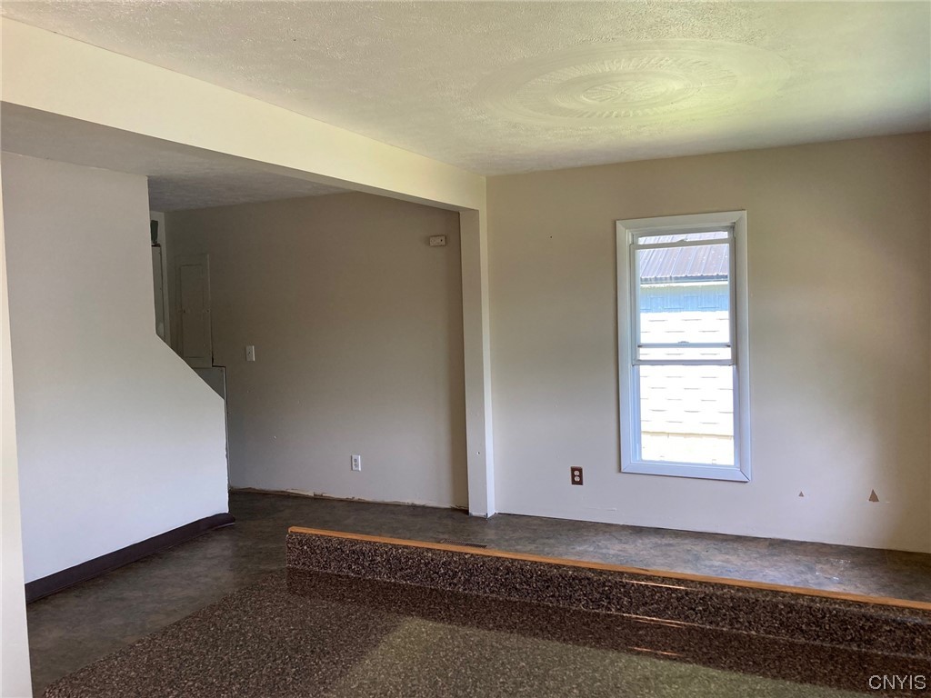 1378 County Rte 12 Schroeppel, NY 13132 - Photo 13 of 35 Living area looking towards stair to 2nd floor.