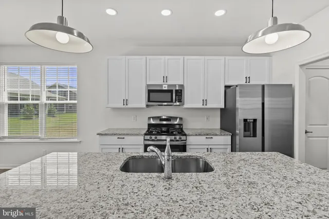 a living room with fireplace furniture and a flat screen tv