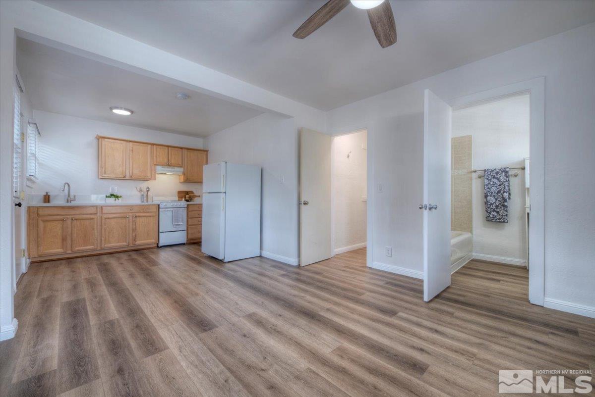485 East 7th Street Reno, NV 89512 - Photo 23 of 31 a view of a kitchen with wooden floor electronic appliances and window