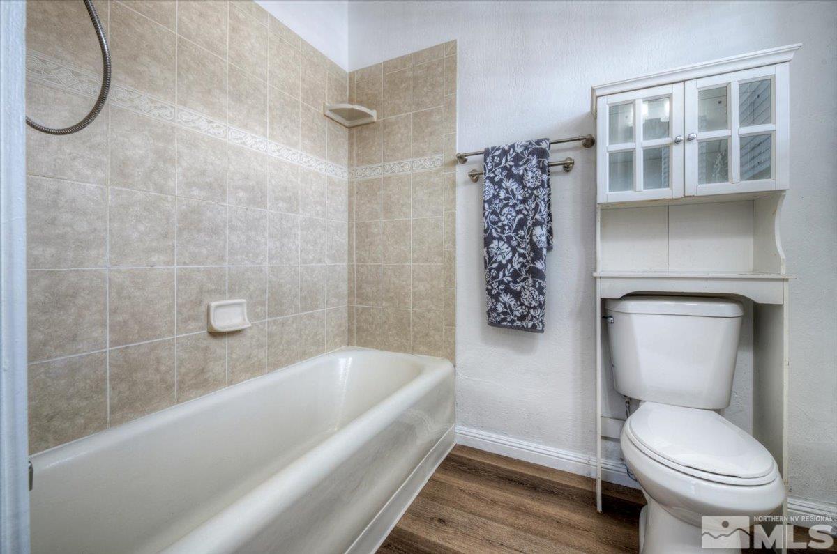 485 East 7th Street Reno, NV 89512 - Photo 24 of 31 a bathroom with a toilet and a shower