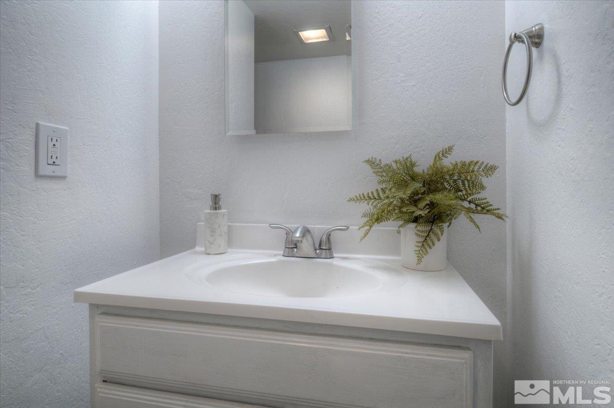 485 East 7th Street Reno, NV 89512 - Photo 27 of 31 a bathroom with a sink and a mirror