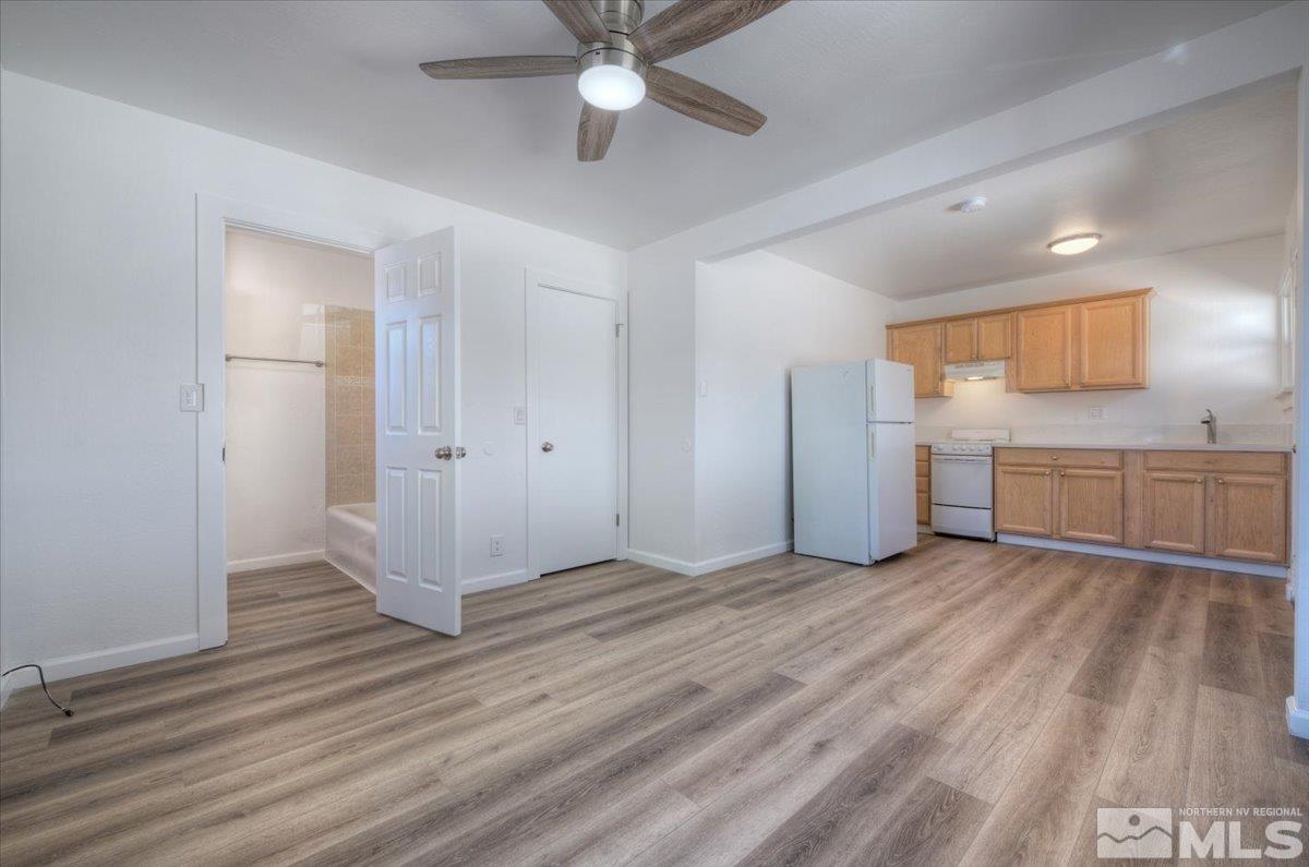 485 East 7th Street Reno, NV 89512 - Photo 28 of 31 an empty room with wooden floor cabinet and windows