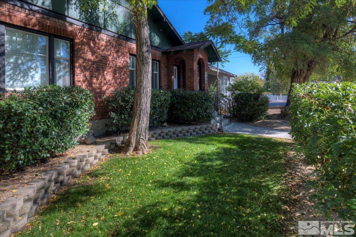 485 East 7th Street Reno, NV 89512 - Photo 5 of 31 a backyard of a house with plants and large tree