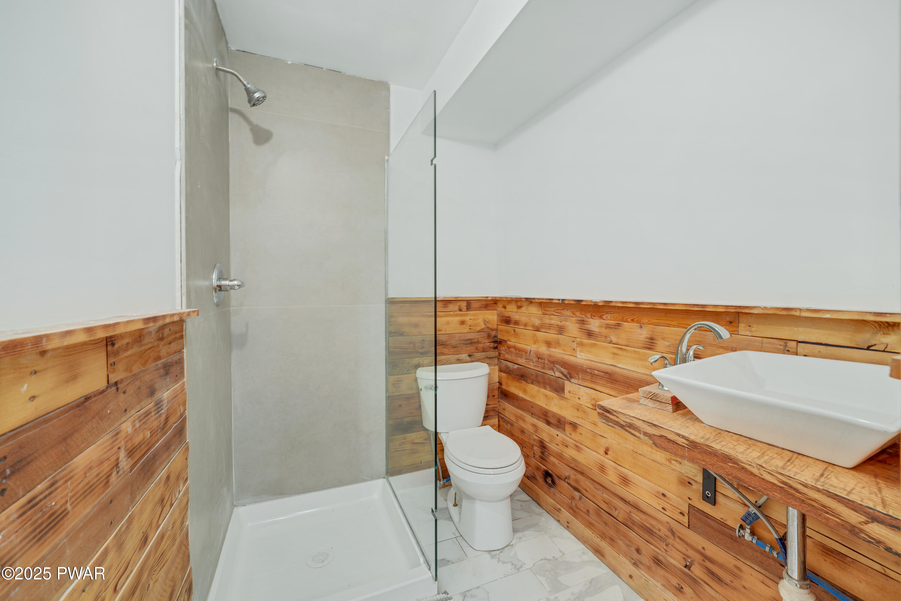 155 Fox Road Dingmans Ferry, PA 18328 - Photo 22 of 25 a bathroom with a toilet a sink and shower