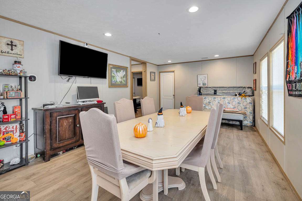 3069 Mineral Springs Road Waynesville, GA 31566 - Photo 15 of 35 a living room with furniture and a flat screen tv