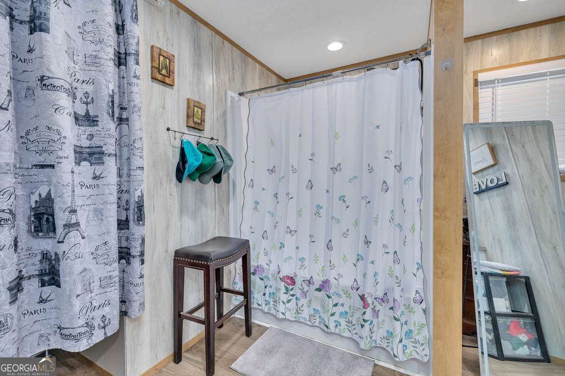3069 Mineral Springs Road Waynesville, GA 31566 - Photo 22 of 35 a bathroom with a shower and a sink