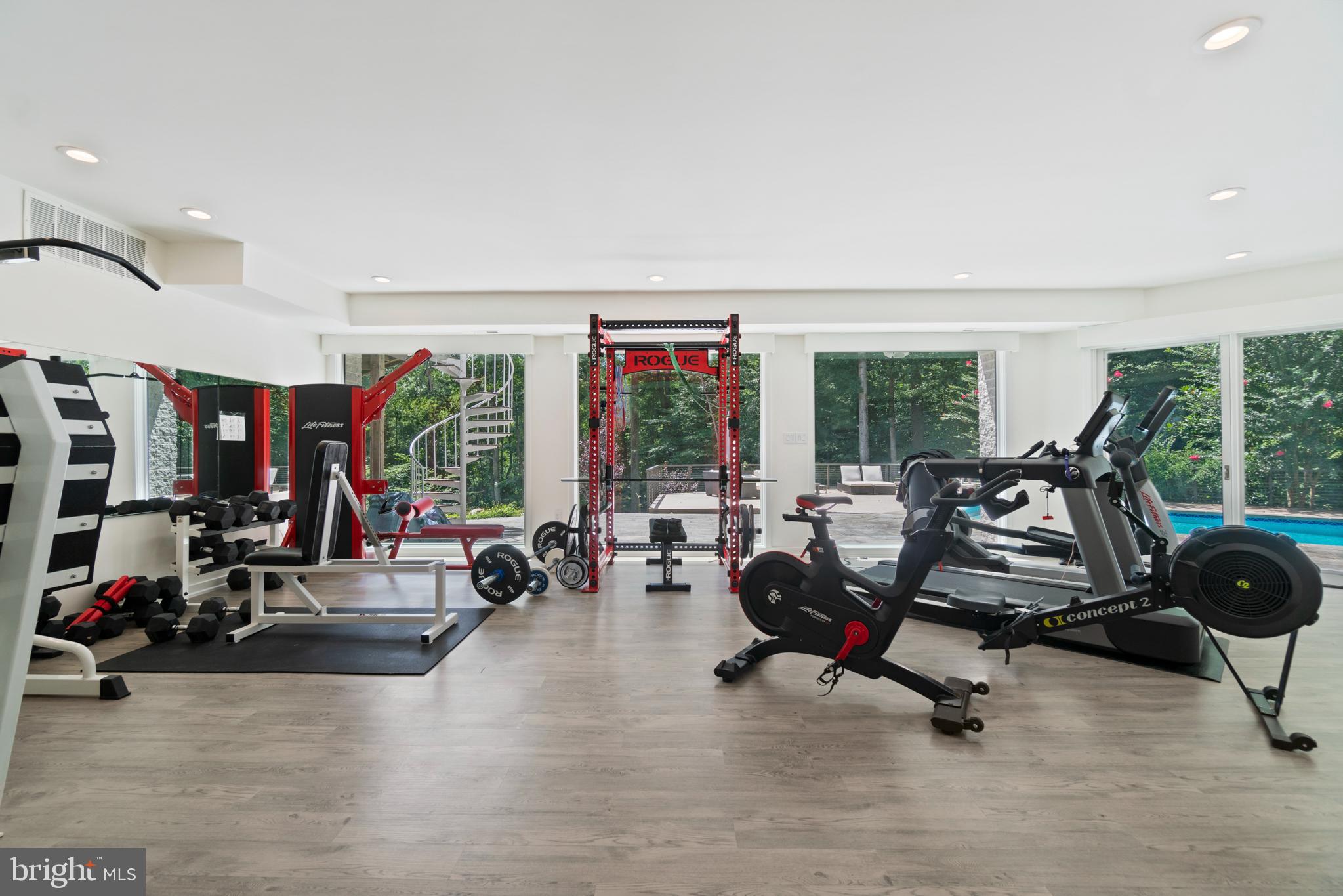 7545 Potomac Fall Road McLean, VA 22102 - Photo 43 of 56 Lower level family room with pool view