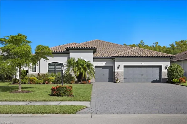 a front view of a house with a garage