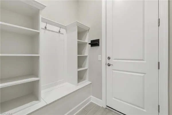 a bathroom with a walk in closet