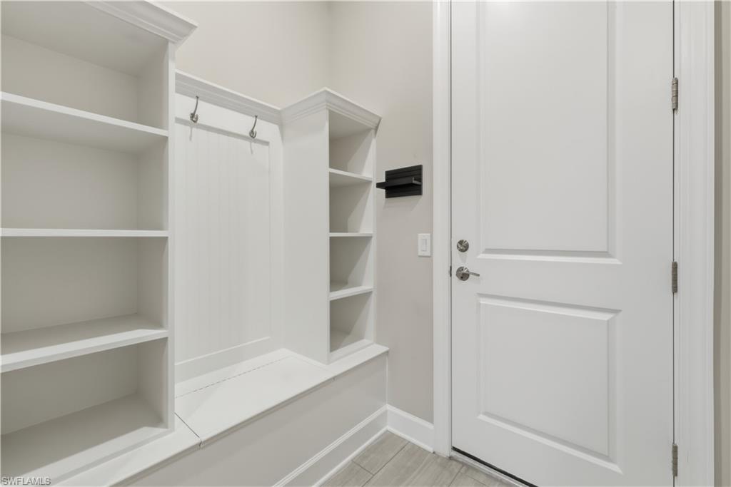 19074 Elston Way Estero, FL 33928 - Photo 19 of 50 a bathroom with a walk in closet